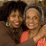 67349972-mature-african-american-mother-hugging-her-daughter-